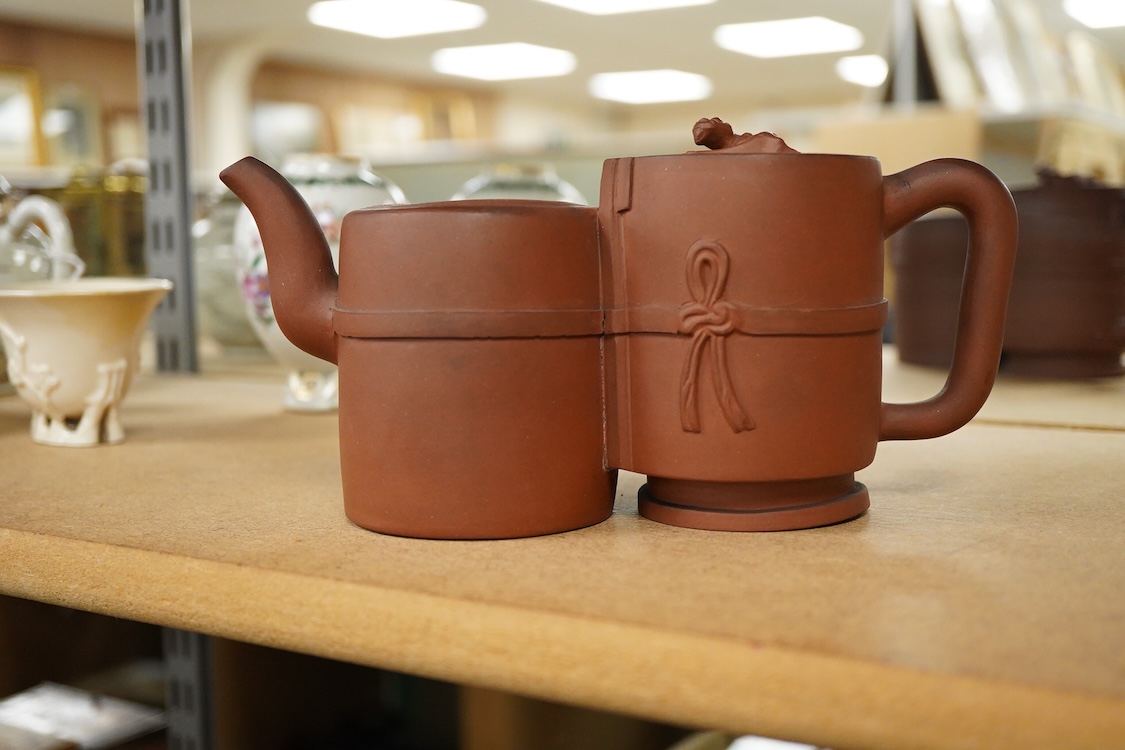 A Chinese Yixing conjoined teapot and cover, 21cm wide